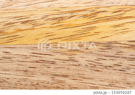 Mango wood texture top view. Kitchen wooden tray background, organic Mangifera indica veneer Mango wood texture top view. Kitchen wooden tray background, organic Mangifera indica veneer 133050287