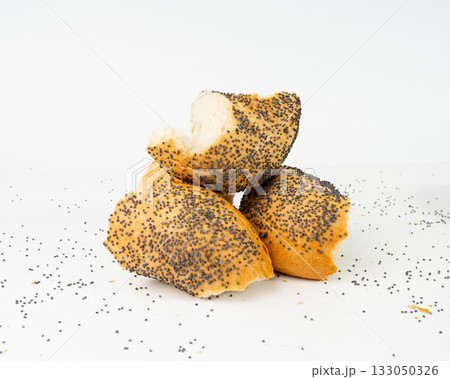 Broken Poppy Seed Bagel Isolated, Round Bread Bun, Poppyseed Wheat Bakery Pieces for Breakfast Broken Poppy Seed Bagel Isolated, Round Bread Bun, Poppyseed Wheat Bakery Pieces for Breakfast 133050326
