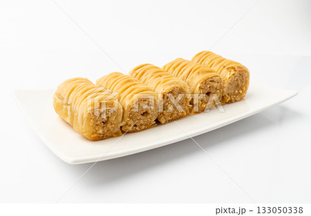 Rolled Baklava Isolated, Ramadan Dessert Roll on Restaurant Plate, Eastern Sweet Pastries 133050338