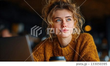 Young woman enjoys quiet time in a cafe while sipping coffee and reflecting on her thoughts during the afternoon hours Young woman enjoys quiet time in a cafe while sipping coffee and reflecting on her thoughts during the afternoon hours 133050395