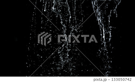 Freeze Motion Shot of Water Stream Isolated on Black Background Freeze Motion Shot of Water Stream Isolated on Black Background 133050742