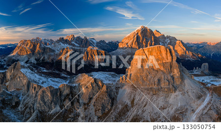 Panorama of the Dolomites mountains during autumn sunrise. Beautiful mountians of Alpi Dolomiti in Italy, South Tirol Panorama of the Dolomites mountains during autumn sunrise. Beautiful mountians of Alpi Dolomiti in Italy, South Tirol 133050754