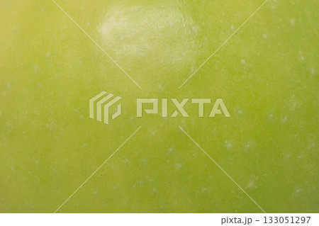 Texture of a green apple as a background macro photo. 133051297