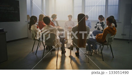 Group of Students Participates in Classroom Talk on Mental Health Guided by Compassionate Teacher 133051490