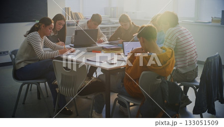 Young Pupils Deeply Concentrated Around Shared Table, Working on Group Project Young Pupils Deeply Concentrated Around Shared Table, Working on Group Project 133051509