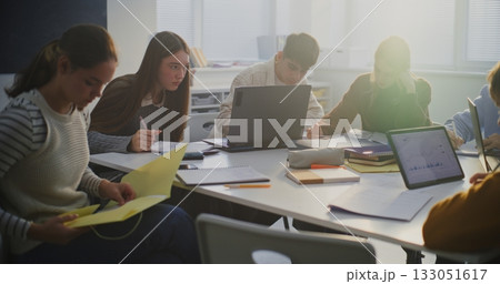 Group of Students Gathered Around Shared Workspace Group of Students Gathered Around Shared Workspace 133051617