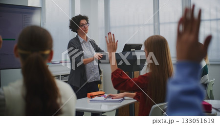 Female Educator in Computer Programming Class Presents Software Code on Smartboard 133051619