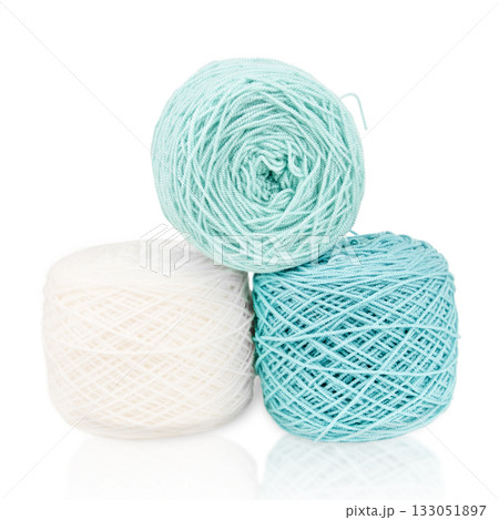 White and green knitting yarn isolated on white background White and green knitting yarn isolated on white background 133051897