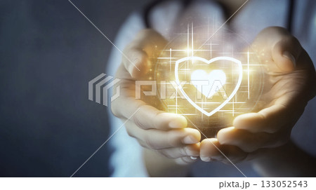 A dedicated healthcare professionals hands are gently holding a glowing medical cross symbol that signifies care A dedicated healthcare professionals hands are gently holding a glowing medical cross symbol that signifies care 133052543