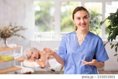 Young woman masseuse posing in spa salon 133053803