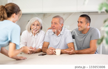 Married couple and senior parents talk about home life 133053806