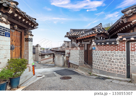 Korean traditional Hanok street with unique brick walls under a bright blue sky at this famous cultural landmark 133055307