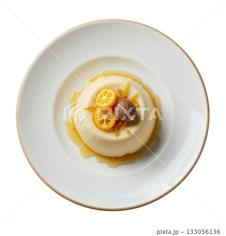 Elegant Nutmeg Cremeux dessert, silky spiced cream with candied kumquat zest and single nutmeg shaving on plate 133056136