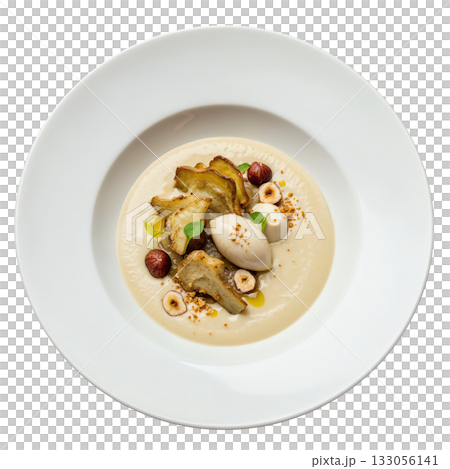 Comforting, creamy Jerusalem artichoke veloute soup in bowl with hazelnut, delicious gourmet appetizer dish 133056141