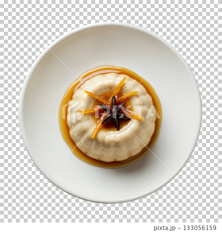 Inviting clove cremeux, silky spiced cream dessert with molasses drizzle, orange zest and star anise on plate 133056159