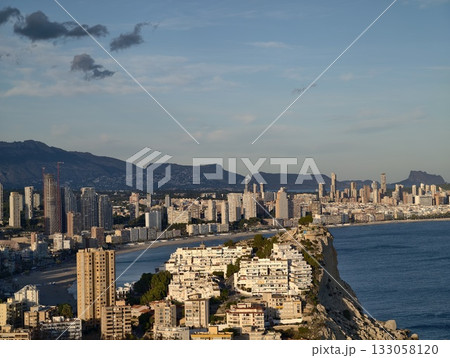 elevated vantage point showcasing diverse urban architecture along curving beachfront shoreline elevated vantage point showcasing diverse urban architecture along curving beachfront shoreline 133058120