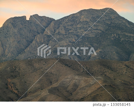 sunset hill landscape, distant hills with pastel sky, eroded slopes under gentle sunset glow sunset hill landscape, distant hills with pastel sky, eroded slopes under gentle sunset glow 133058145