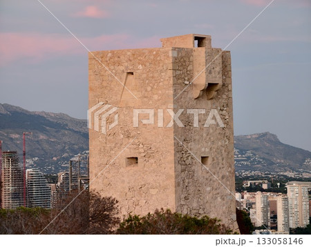 historic coastal fortress, old stone rampart providing scenic outlook over coast during twilight 133058146