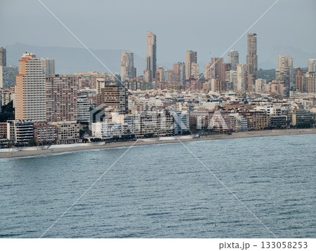 bright seaside skyline filled with bustling buildings, vivid urban seafront with events and lively bright seaside skyline filled with bustling buildings, vivid urban seafront with events and lively 133058253