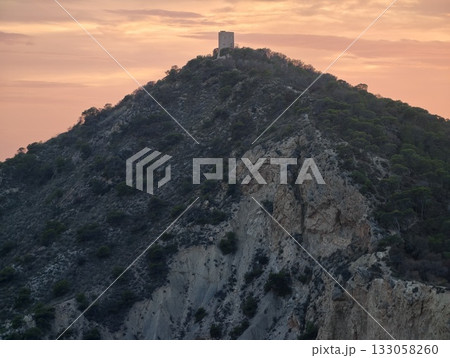 sunset lighthouse scene, scenic image capturing vintage tower glowing warmly on seaside hill sunset lighthouse scene, scenic image capturing vintage tower glowing warmly on seaside hill 133058260