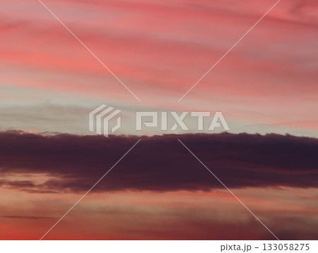 serene sunset sky with flowing clouds and subtle gradients casting quietness over distant ocean serene sunset sky with flowing clouds and subtle gradients casting quietness over distant ocean 133058275