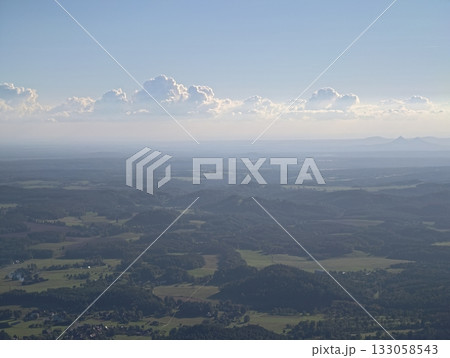 serene outdoor scenery with clouds and fields, tranquil aerial view of countryside with hills 133058543