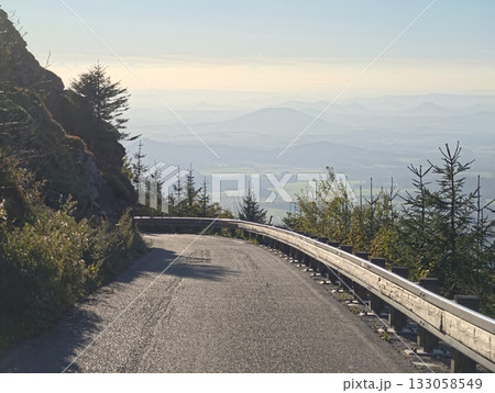 misty hills and warm morning light, peaceful landscape with gentle mists and scenic views at dawn 133058549