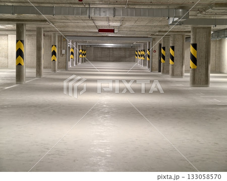 industrial cavern solitude, open subterranean lot featuring repeating support columns and muted 133058570