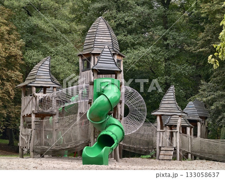 outdoor area with castle towers, exterior play zone with turrets resembling wooden castle structure 133058637