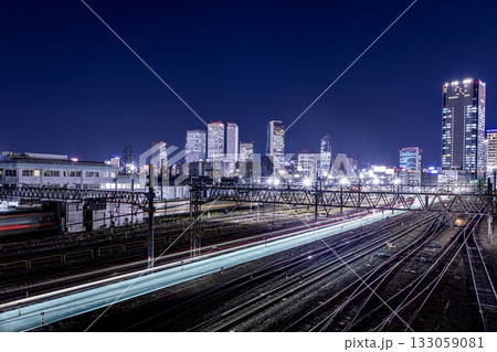 名古屋市、JR東海名古屋車両区と名古屋駅のビル群の夜景 133059081