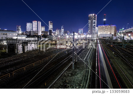 名古屋市、JR東海名古屋車両区と名古屋駅のビル群の夜景 133059083