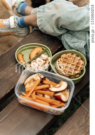 Healthy Kids Lunch Box Outdoors. Food snacks for children on the street. 133060858