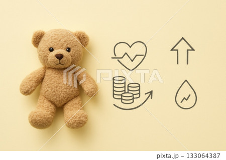 Teddy bear and financial health icons on yellow background Teddy bear and financial health icons on yellow background 133064387