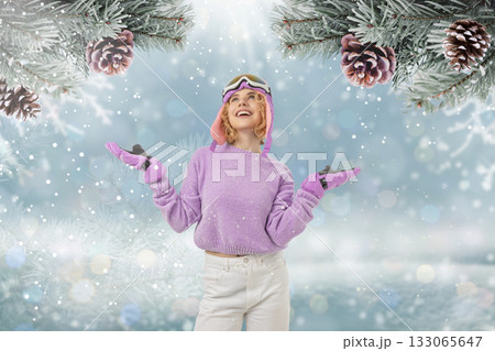 Girl in a purple sweater smiles with arms outstretched Girl in a purple sweater smiles with arms outstretched 133065647