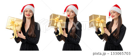 Woman in Christmas hat holds gold gift box, isolated, PNG 133065703