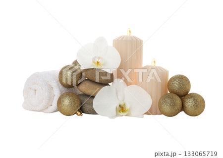 New Year spa setup: candles, towels, stones, on white, PNG 133065719