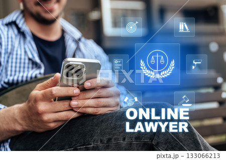 Hands holding smartphone with online legal services displayed in clear focus Hands holding smartphone with online legal services displayed in clear focus 133066213