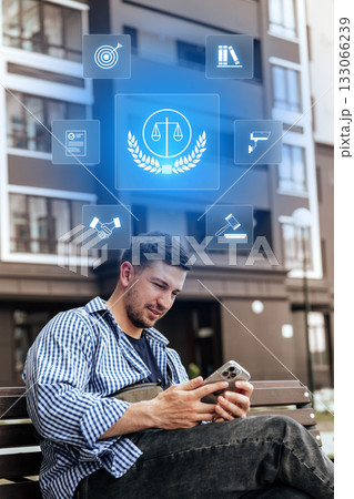 Man on a bench using smartphone while icons of law and justice surround him 133066239