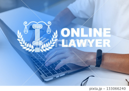 Engaging in legal work online with a laptop and legal symbols in a modern workspace 133066240