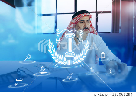 Professional man working thoughtfully on legal matters in an office environment Professional man working thoughtfully on legal matters in an office environment 133066294