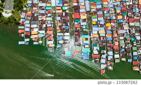 Aerial view of fishing village with wooden houses on stilts in the sea. Sandakan, Borneo. Malaysia. 133067262