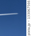 Airplane in the blue sky with contrails. 133067566