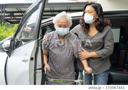 Asian senior woman patient sitting on walker prepare get to her car, healthy strong medical concept. Asian senior woman patient sitting on walker prepare get to her car, healthy strong medical concept. 133067881