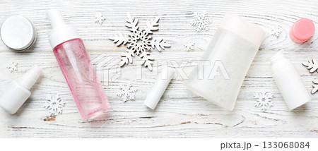 Makeup products and Christmas decorations on color background. Top view New year Beauty concept with copy space 133068084