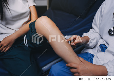 Rehabilitation therapy Professional male physiotherapists working in rehabilitation centers while treating male patients with leg and muscle pain. 133069389