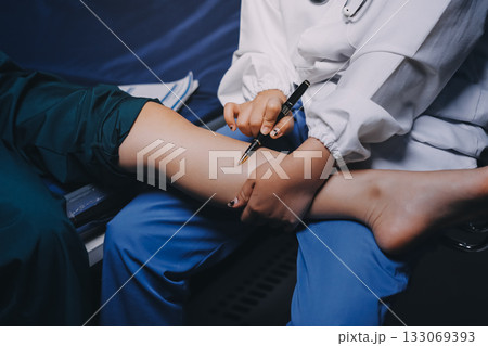Rehabilitation therapy Professional male physiotherapists working in rehabilitation centers while treating male patients with leg and muscle pain. 133069393