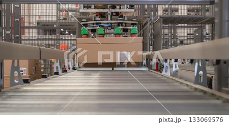packing line in a logistics warehouse. conveyor belt in a modern production line 133069576