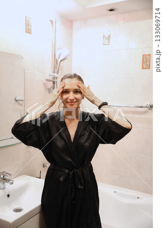 Woman Applying Face Cream, Bathroom Routine 133069714