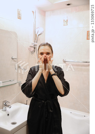 Woman Applying Face Cream, Bathroom Routine Woman Applying Face Cream, Bathroom Routine 133069715
