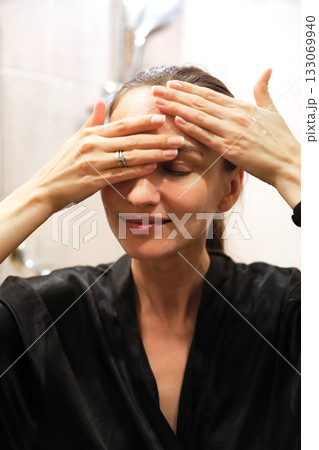 Woman Applying Face Cream, Bathroom Routine Woman Applying Face Cream, Bathroom Routine 133069940